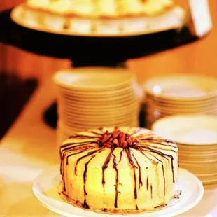 a cake with chocolate drizzle on top