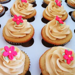 a box of cupcakes with frosting