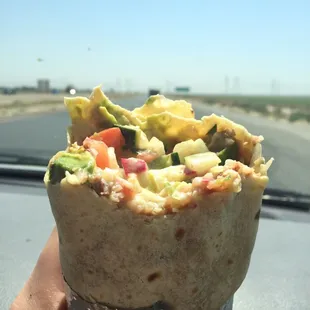 She made us a veggie burrito even tho it wasn't on he menu! Avocados, tomatoes, bell peppers, cucumbers, beans, rice, and cheese! Yum!