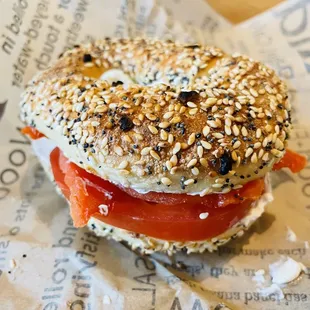 Everything bagel with lox and tomato.