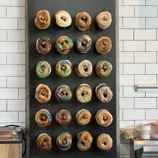 a display of doughnuts on a baking sheet