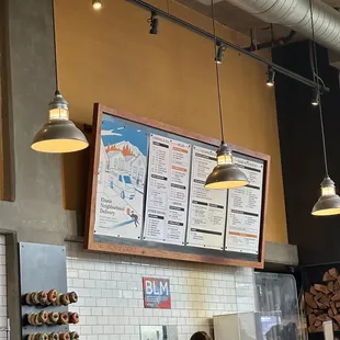 a woman sitting at a counter in a restaurant