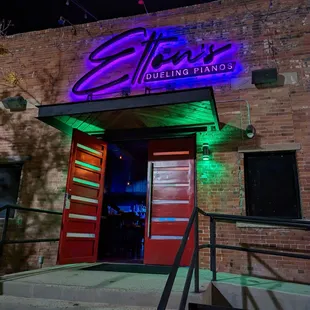 neon sign on brick building