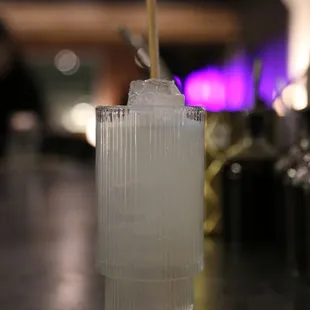 a glass with a straw and a straw in it