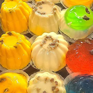 a variety of colored cakes