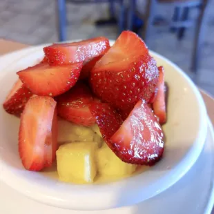 a bowl of strawberries and bananas