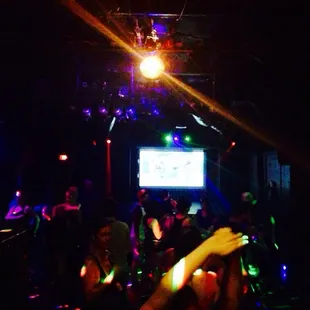 a group of people dancing in a club