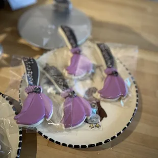 a plate of decorated cookies on a table