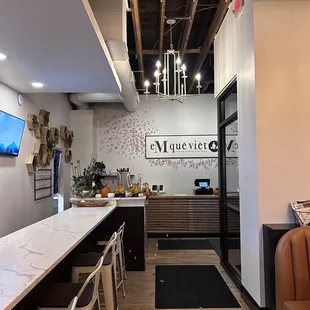a view of a restaurant with a long counter