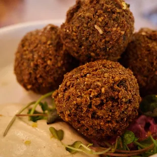 Green Falafel (beer tzaziki, garlic tahini, dhania spice)