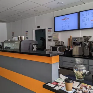 a coffee shop counter and menus