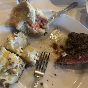 Perfect medium rare, aged N. Y. Strip / wonderfully tender with loaded baked potato