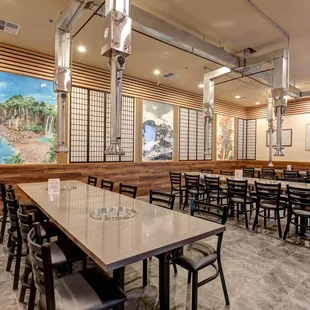 Party room featuring paintings of scenic Korean destinations and copies of the Hunminjeongeum detailing the creation of the Hangul script.