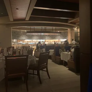 a dining room with tables and chairs