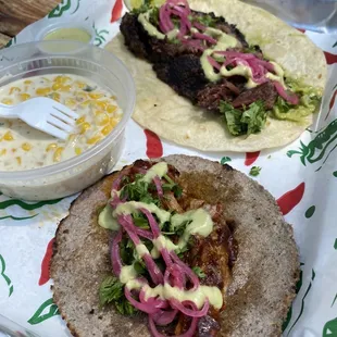 Bark(brisket taco), Bad Hombre(adobo pulled pork), and jalapeño cream corn