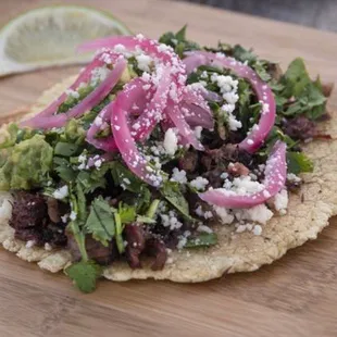 Smoked Barbacoa, guac, onions served on fresh heirloom corn tortilla