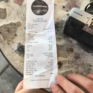 a person holding a receipt