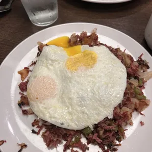 a plate of eggs and hash browns