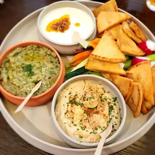 Mezze Platter: Served with crudite and pita - creamy hummus, crispy garlic, whipped feta cheese with veggies