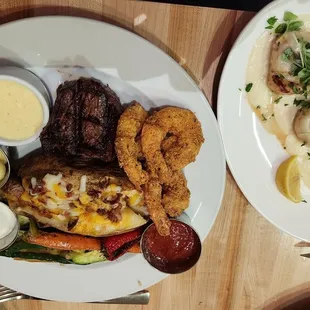 Petite filet,  loaded baked potato,  shrimp and side of scallops.