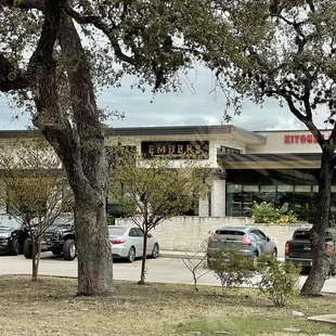 cars parked in front of a restaurant