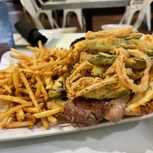 Steak sandwich and fries--with amazing onion rings. Very big portion! Had to leave the bread on the plate.