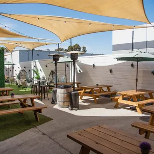 patio area with tables and umbrellas