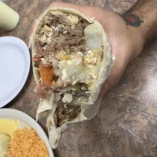 Breakfast burrito with brisket + requested to add in refried beans
