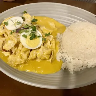 Chicken in yellow chili sauce with Peruvian seasoning