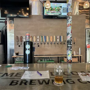 a beer glass on the bar