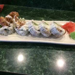 a plate of sushi rolls