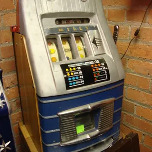 A vintage Mills tabletop slot machine.