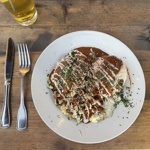 a plate of food on a wooden table