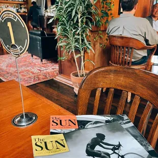 I love they have copies of The Sun here :) *interior of cafe*