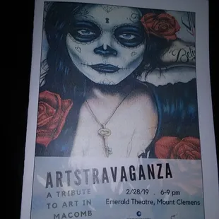 a poster of a woman with a cross on her shoulder