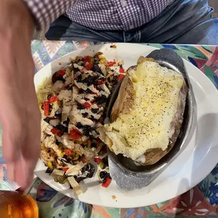 a plate of food and a glass of beer