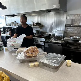 Trays of Ribs, Whole Chicken, muffins, coleslaw, beans, potato salad, French fries, butter spread