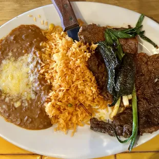 Carne asada with refried beans and rice