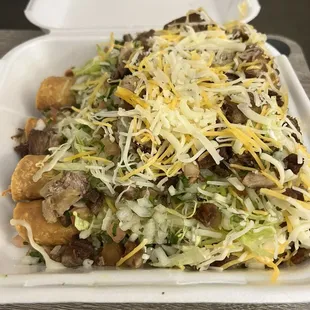 Five Supreme Rolled Tacos (Chicken inside and Carnitas on top)