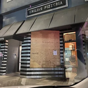 Emilia&apos;s Pizzeria -- a true one man show. Don&apos;t be fooled by the boarded up window!