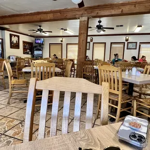 a dining room with tables and chairs