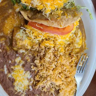 2 tacos and enchilada and beans and rice.