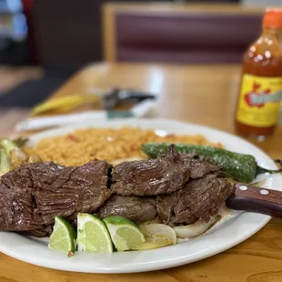 a steak skewer and rice