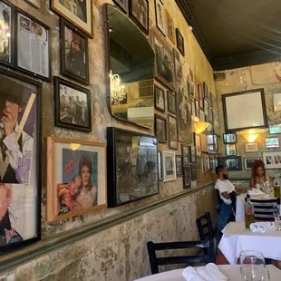 a wall full of framed photos