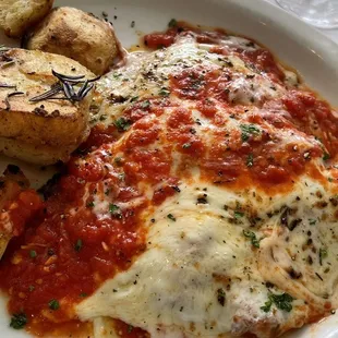 Deliciously large chicken Parmesan with roasted potatoes