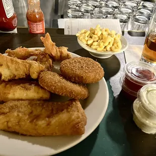 Seafood platter: fish, shrimp and crab cakes with a side of mac and cheese