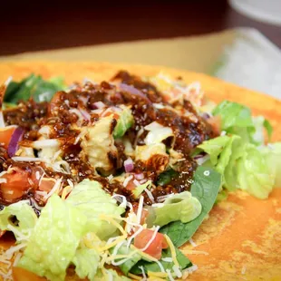 a tortilla with meat and vegetables