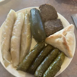 Rolled Cabbage, Rolled Grape leaves, Stuffed Zucchini and a big Meat Pie, and two meat things I can&apos;t remember the name of