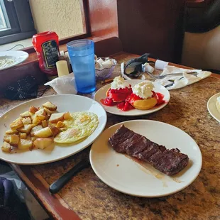 Eggs, red potatoes, steak and mini waffles