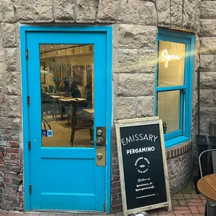 The welcoming bright blue front door.